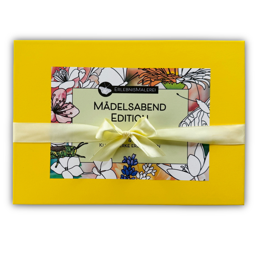 Geschlossene gelbe Geschenkbox „Mädelsabend Edition“ von ErlebnisMalerei mit floraler Illustration auf dem Deckel und cremefarbener Satinschleife.