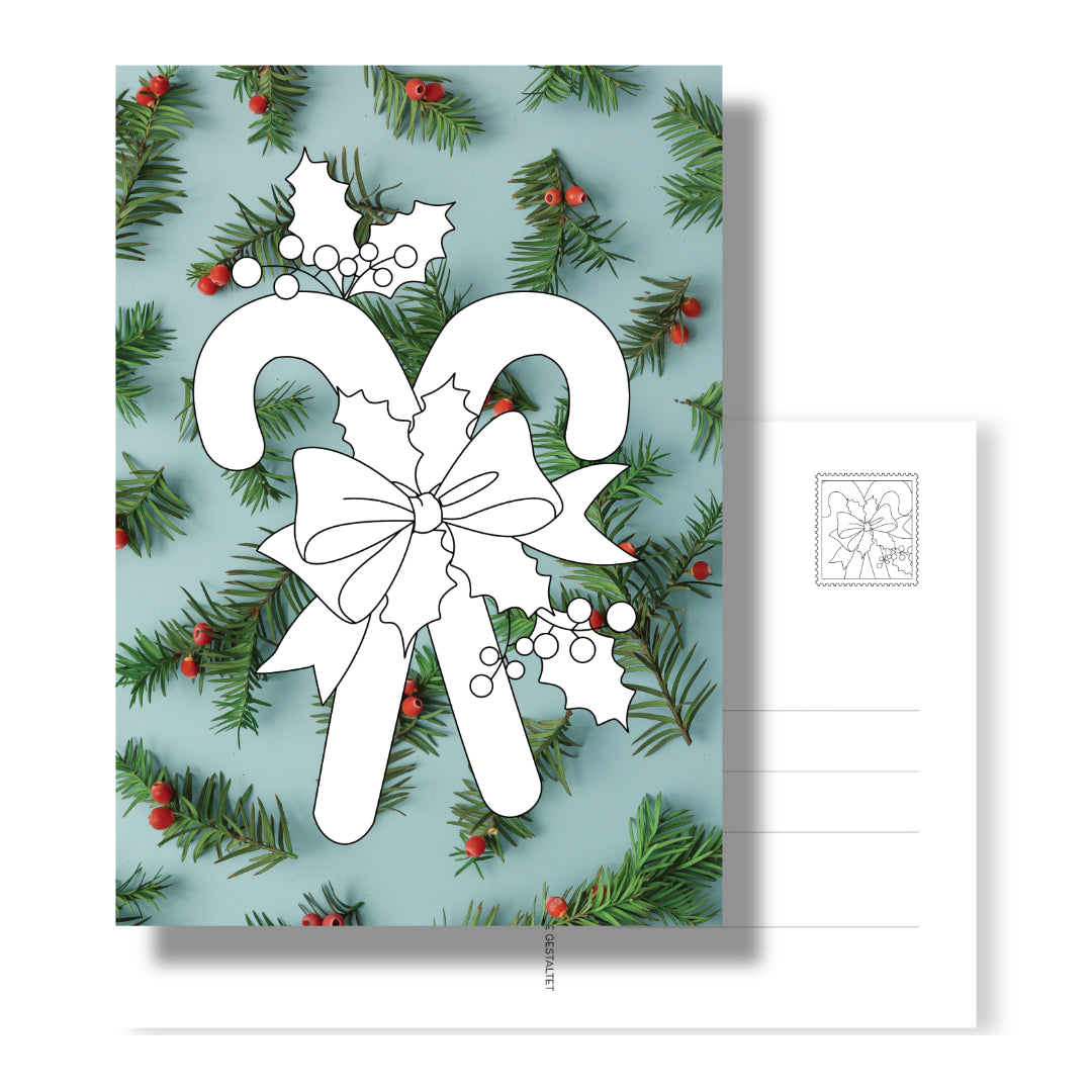 Postkarte mit Zuckerstangen zum Ausmalen auf weihnachtlichen Fotohintergrund. Rückseite mit Adressfeld und Zuckerstangen-Briefgmarke. So persönlich könne weihnachtliche Grüße sein. 